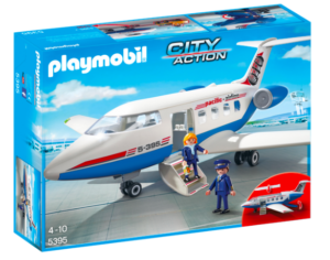 a box with a toy airplane and people