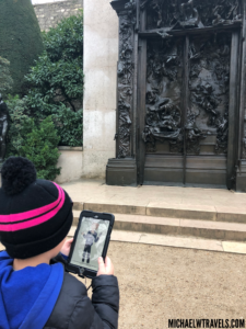 a person taking a picture of a statue