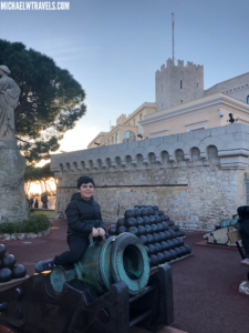 a person sitting on a cannon