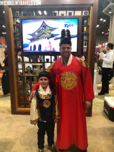 a man and boy in traditional clothing