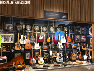 a display of guitars in a store