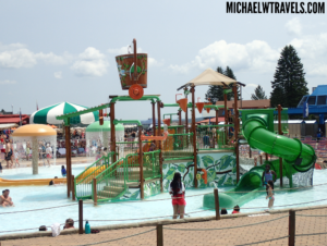 a water park with people and a slide