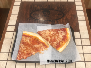 two slices of pizza on a tray
