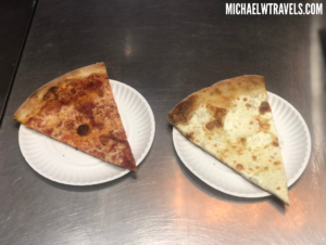 two plates of pizza on a table