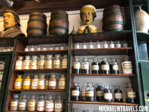 shelves with jars of different colors and sizes on them