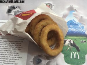 a group of onion rings in a wrapper
