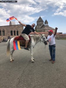 a man on a horse with a flag