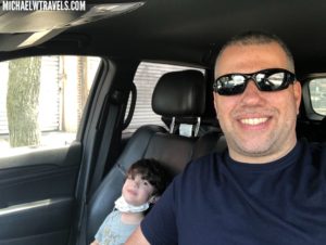 a man and child in a car