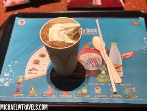 a cup of ice cream on a tray