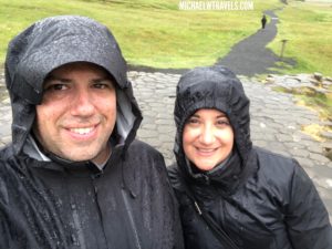 a man and woman wearing rain coats