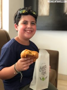 a boy holding a sandwich