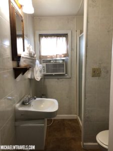 a bathroom with a sink and air conditioner