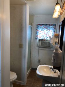 a bathroom with a sink and a window