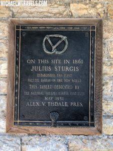 a plaque on a stone wall