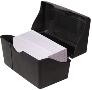 a black plastic box with a stack of cards