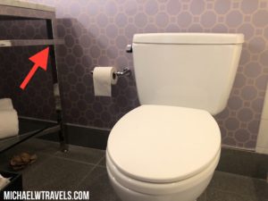 a toilet with a toilet paper roll