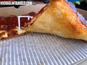 a slice of pizza in a box