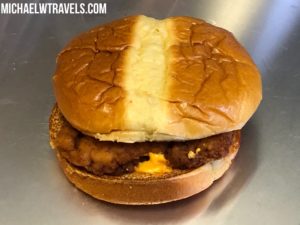 a burger with a double layer of chicken inside
