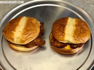 a two hamburgers on a plate