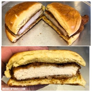 a chicken sandwich with a cut in half