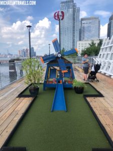 a miniature golf course with a windmill