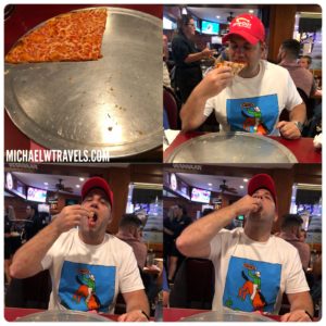 a man eating pizza in a restaurant