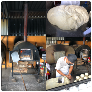 a man making bread in a bakery