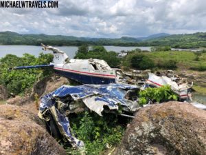 a crashed plane on a rock