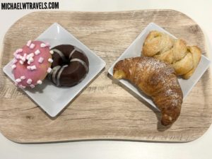 a plate of pastries on a wooden surface