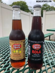 two bottles of soda on a table