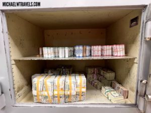 a shelf with stacks of money