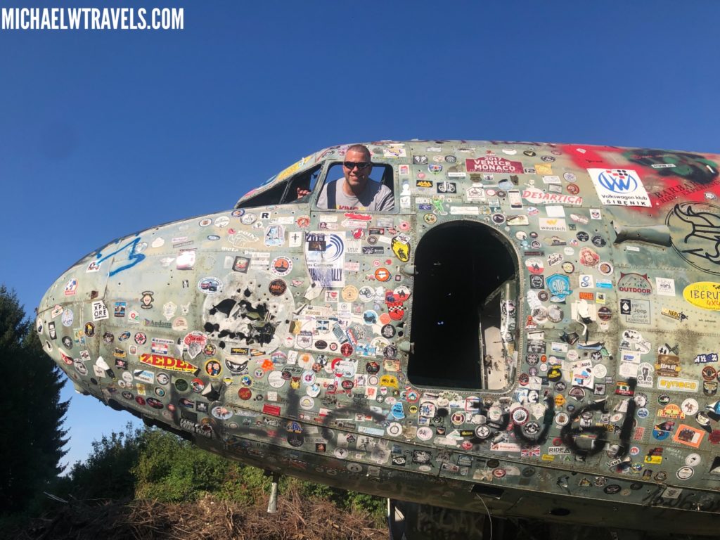 a man in a plane with stickers on it