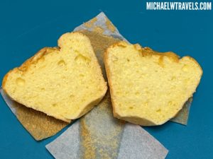 a piece of bread on a blue surface