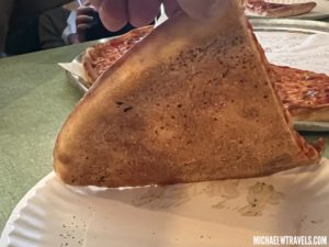 a slice of pizza on a plate