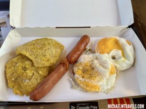 a box of food with sausage and eggs