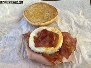 a sandwich with bacon and egg