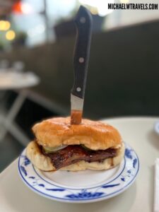 a knife stuck in a burger