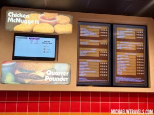 a menu board with a screen on it