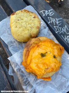 food on a paper on a bench