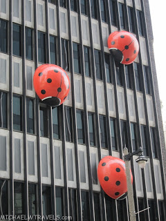 a ladybug shaped balloons on a building