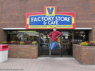 a man jumping in front of a store