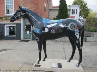 a statue of a horse with a drawing on it