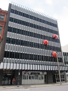 a building with red balls on the side