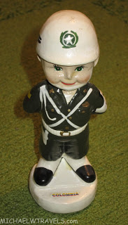 a statue of a boy in uniform
