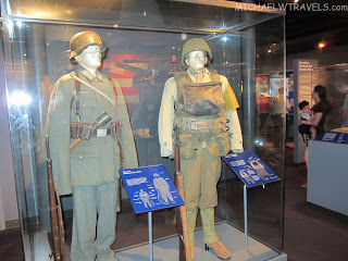 a couple of mannequins in military uniforms