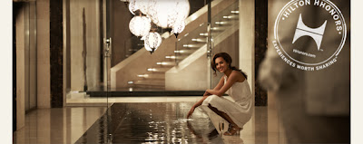a woman in a white dress sitting on a floor
