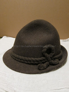 a brown hat with a knot
