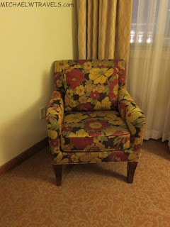 a colorful chair in a corner