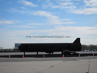 a black rocket on a concrete surface