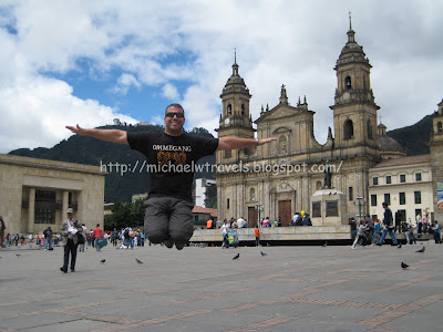 a man jumping in the air in front of a building